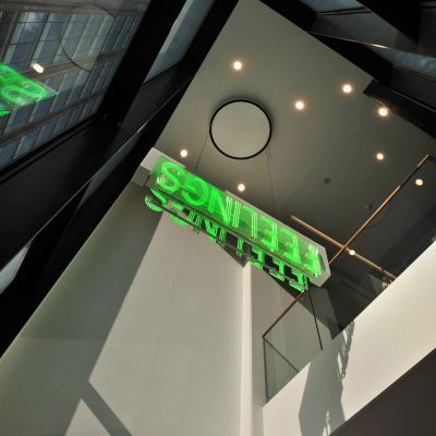Vertical shot showing the green 'Feelings' sign in Milton Court